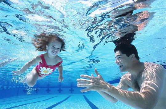 girl swimming underwater